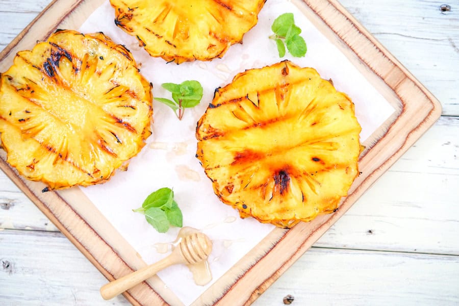 grilled pineapple with honey side with sausages