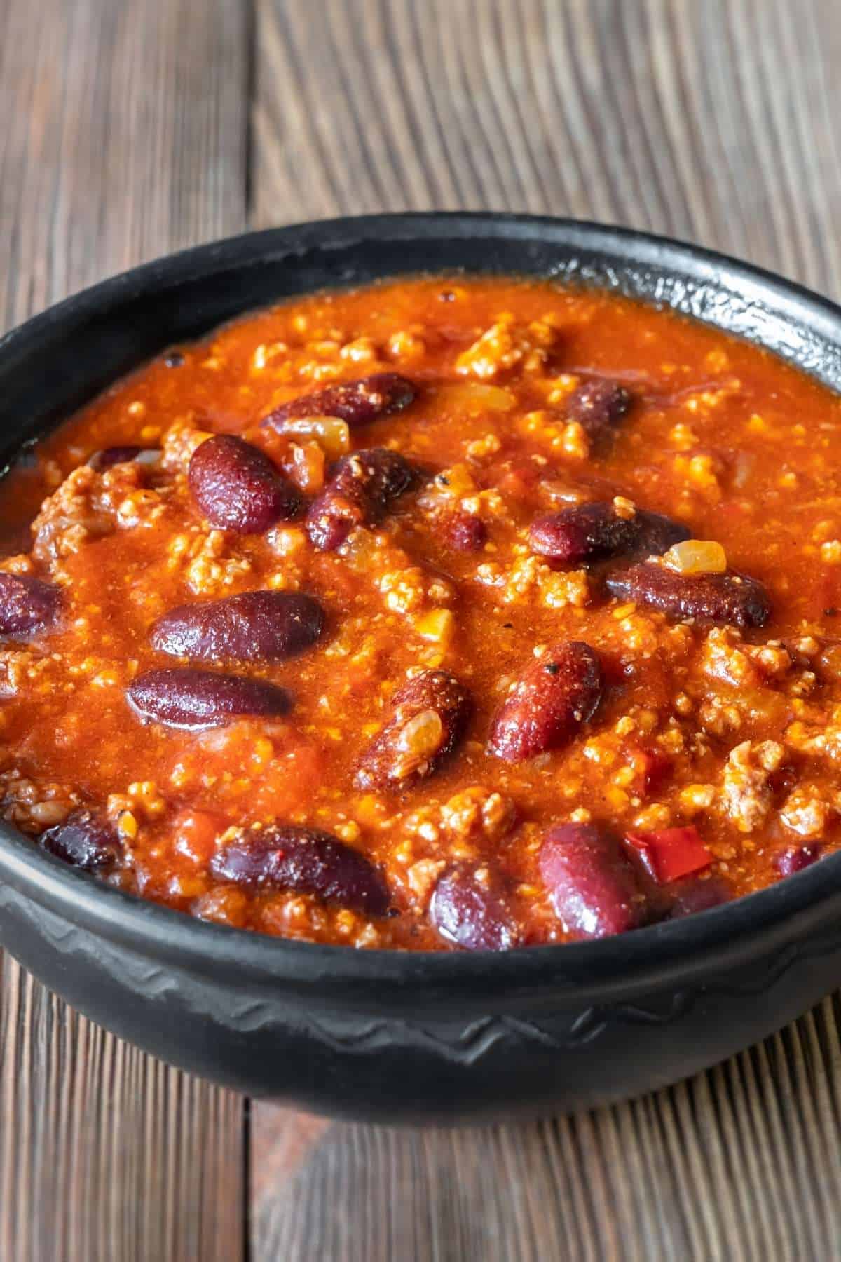hormel chili with beans in a black bowl