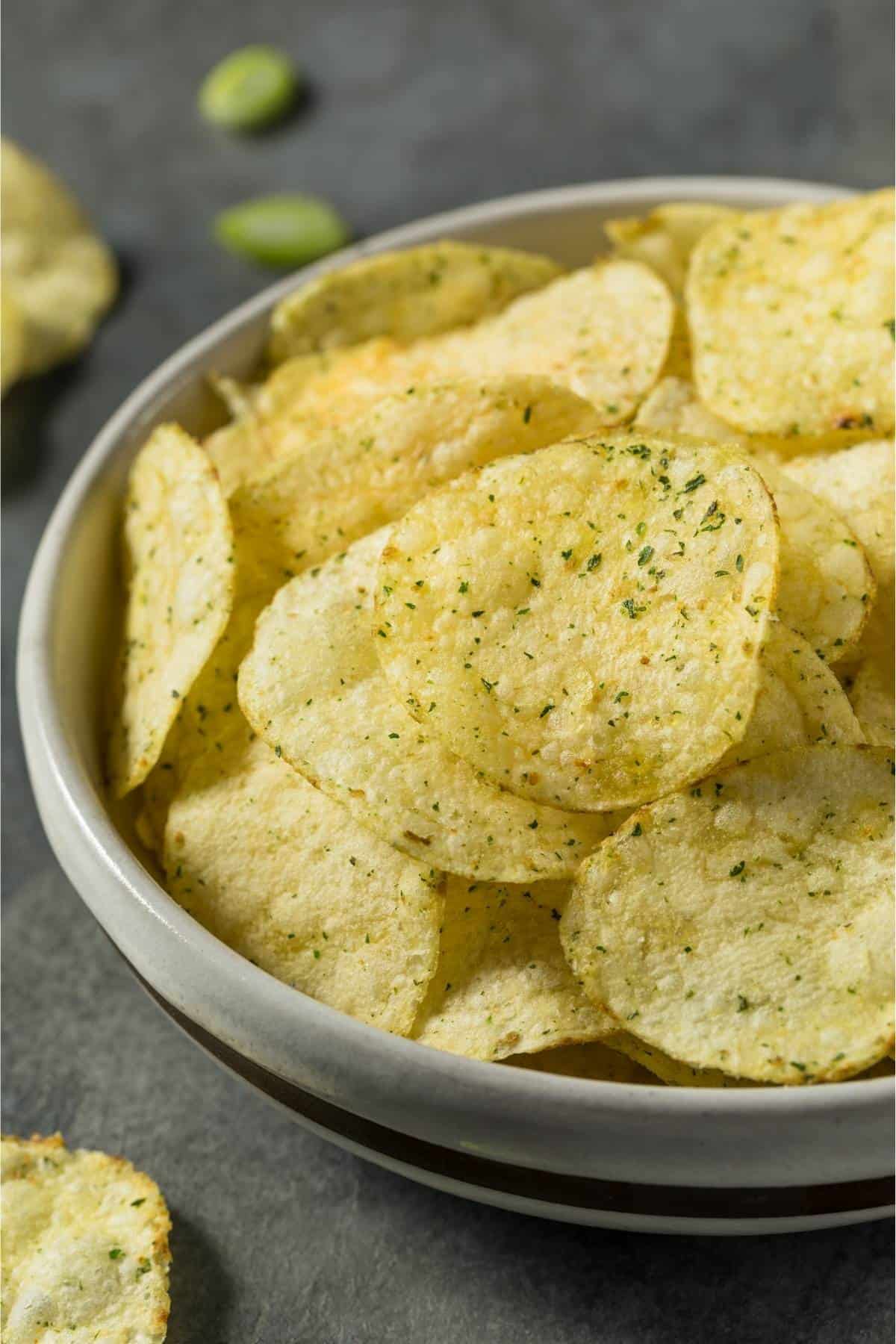 sour cream and onion chips in a bowl sour cream and onion chips in a bowl